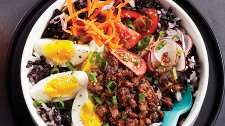 rice bowl with ground beef, hardboiled eggs and shredded veggies
